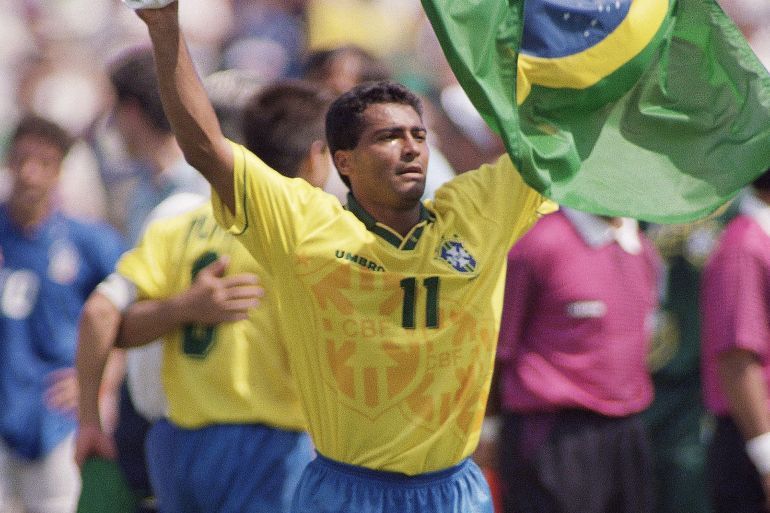 Brazil's Romario cries as he carries his national flag after Brazil's 0-0 (3-2 in shootout) victory over Italy in the World Cup Final match at the Rose Bowl in Pasadena, Calif., Sunday, July 17, 1994. (AP Photo/Hans Deryk)