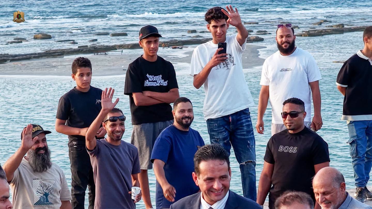 May be an image of one or more people, beard, people smiling and text