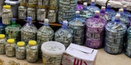 مخبأة داخل زجاجات.. ضبط 25 مليار دينار و4 كيلو ذهب في قضية عدنان الجميلي بالعراق